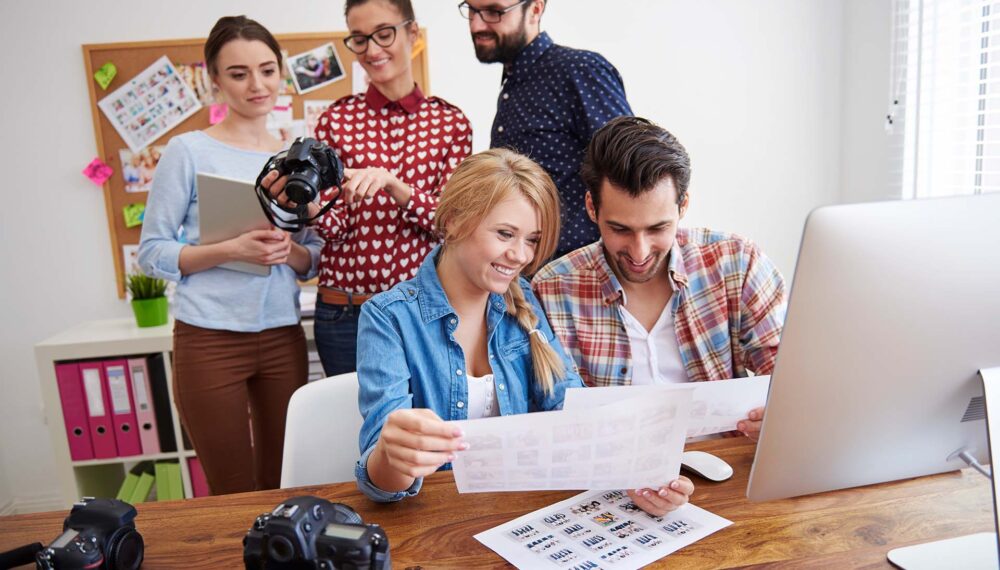 coworkers-office-with-photo-cameras-computer